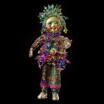 Sun Doll
Size: 5"
Polymer clay face, peyote stitched seed .beads and Swarovski crystals.